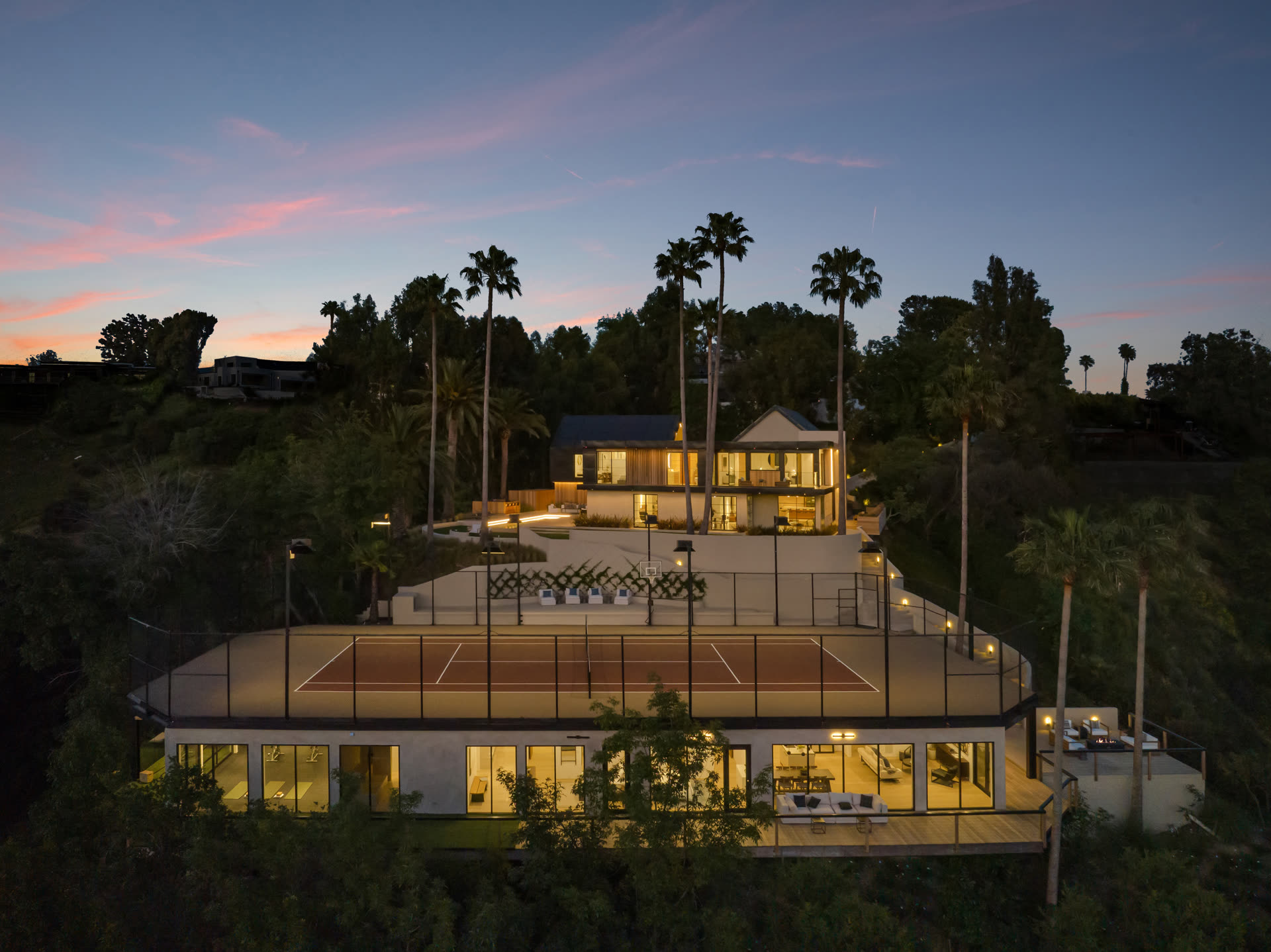 Estate and tennis court at twilight