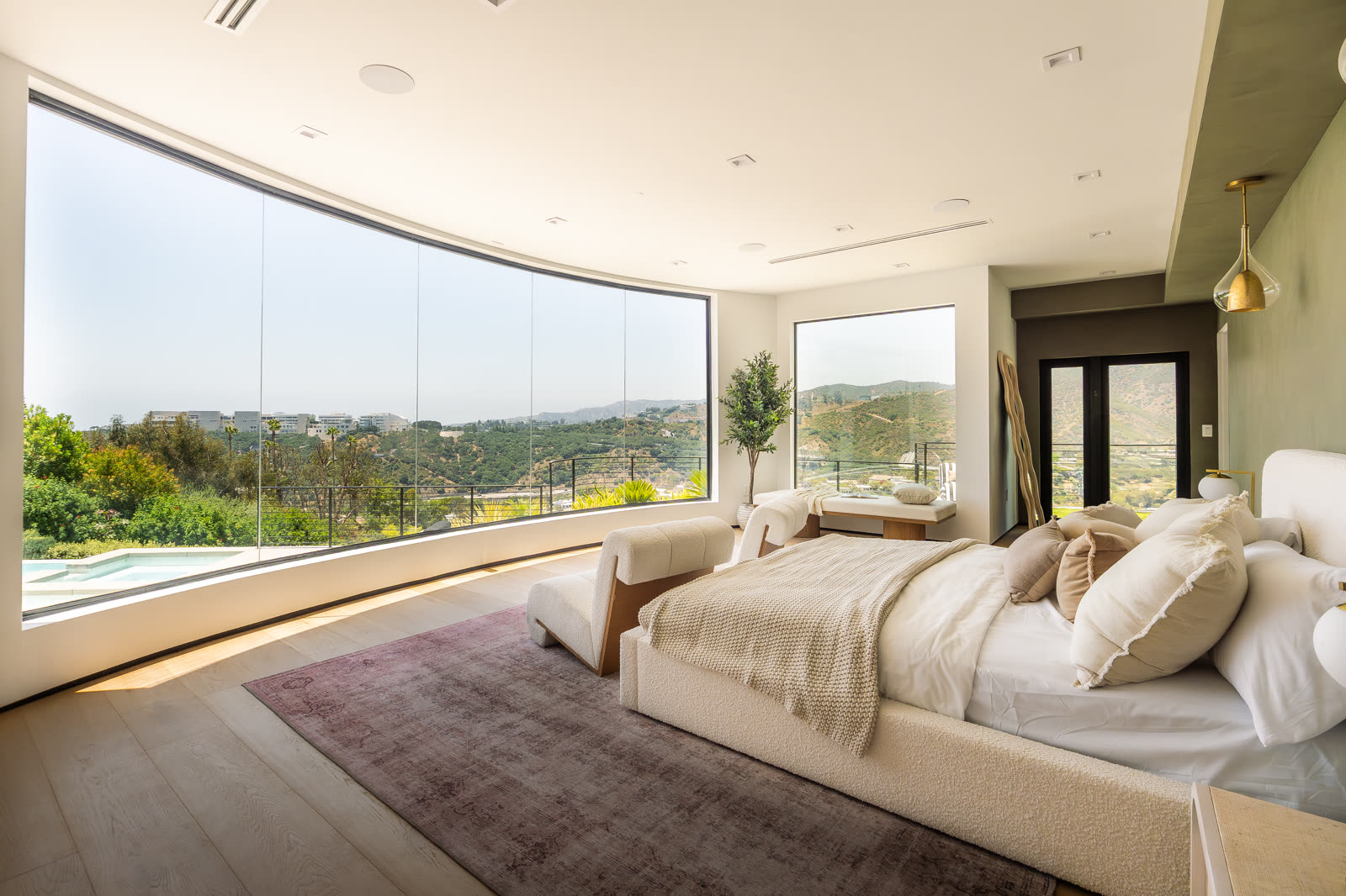 Bedroom with curved panoramic window